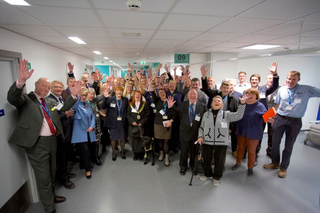 Group photo showing staff, our League of Friends, others involved with the project, and dignitaries, in the new AMU